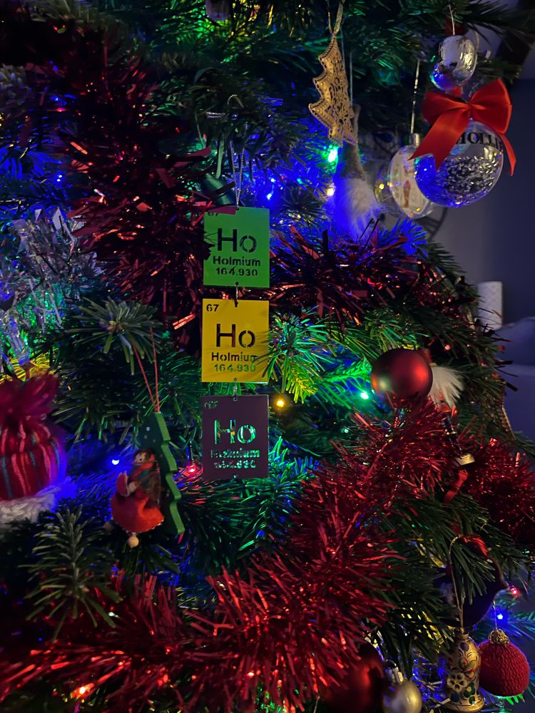 A Christmas bauble with 3 elemental/chemical symbols for holmium - Ho Ho Ho