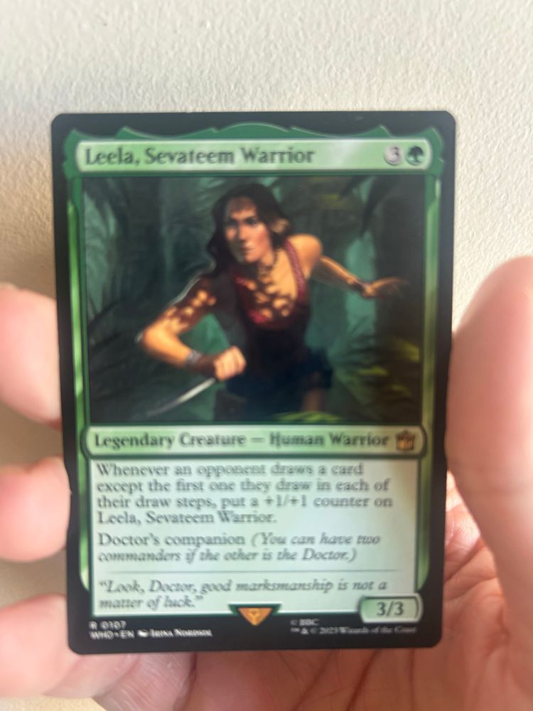 Hand holding Magic: the Gathering card, Leela, Sevateem Warrior