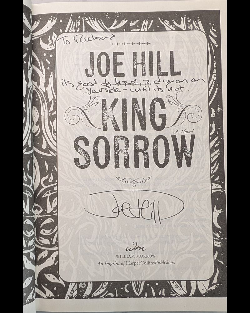 Image of the title page of KING SORROW by Joe Hill, inscribed by Joe Hill to Richard. The inscription reads:
To Richard - It's good to have a dragon on your side - until it's not.