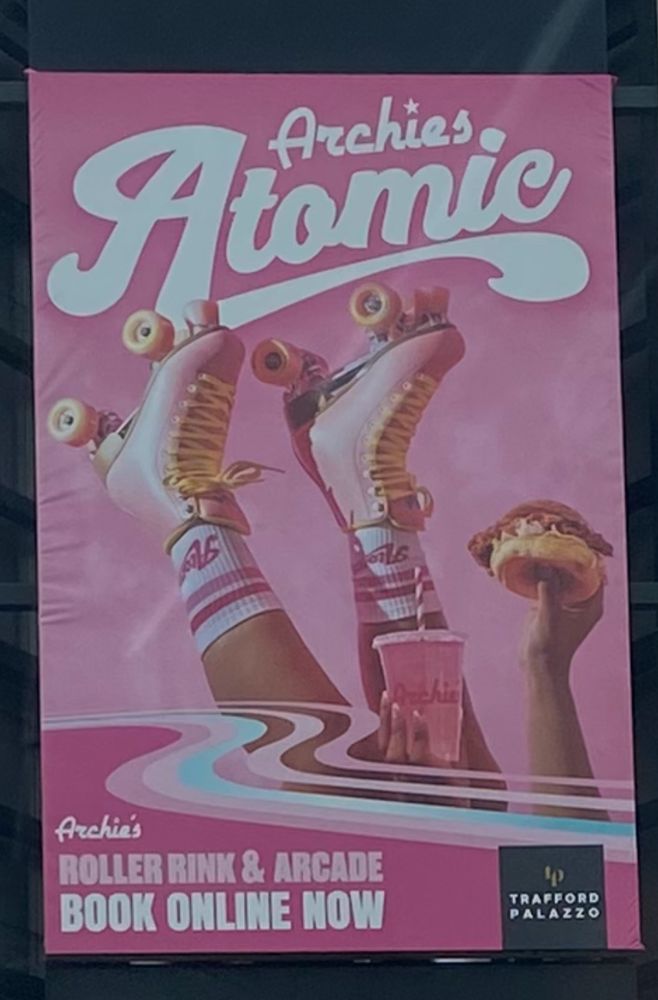 A poster advertising burger/skating place Archie’s, featuring a pair of female legs sticking in the air wearing roller boots. She’s also holding up a burger and a drink, presumably an afterthought when the original concept appeared to just be “someone’s getting shagged”.