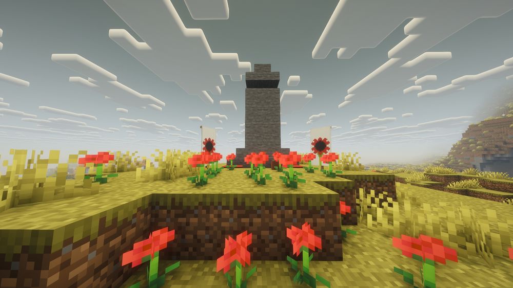 A stone cenotaph with poppies at front. Built in Minecraft by my students.