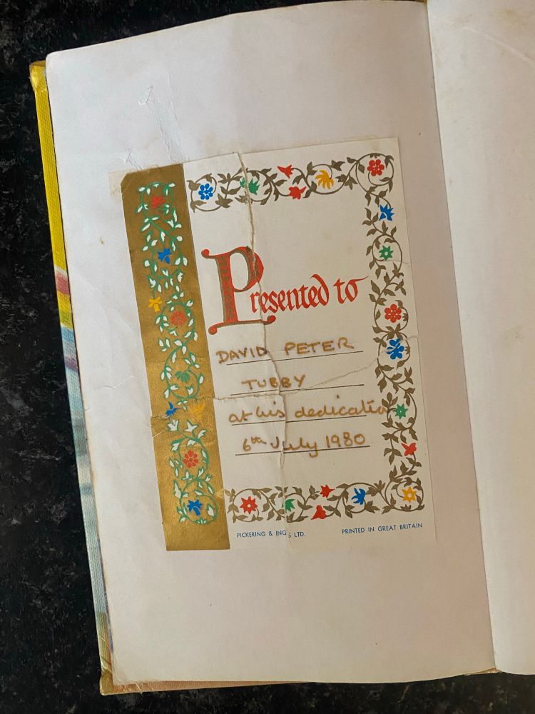 Insert reading ‘Presented to David Peter Tubby at his dedication. 6th July 1980.’