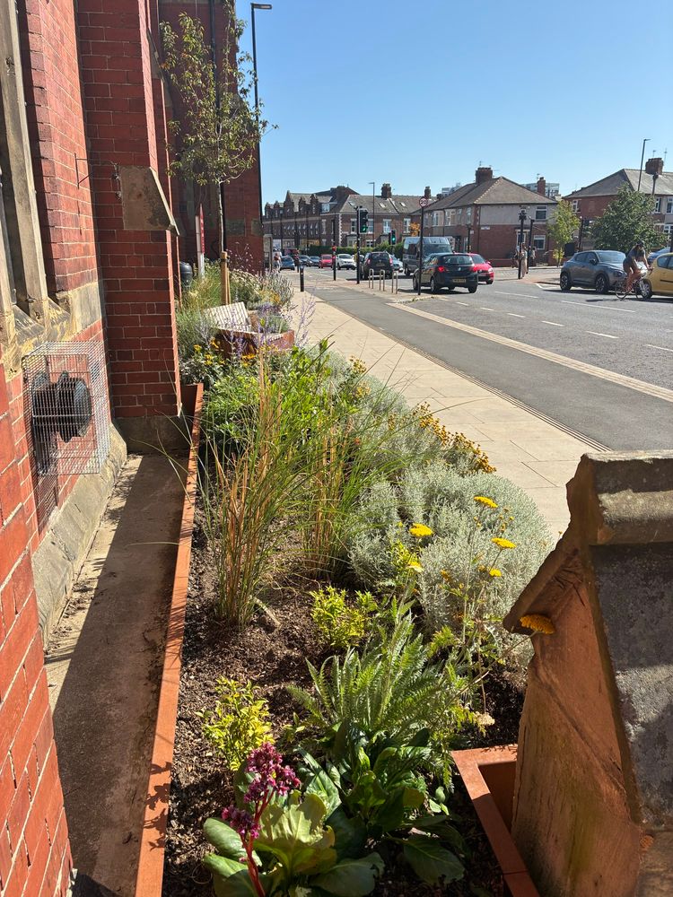 The view of the church garden along Heaton Road 