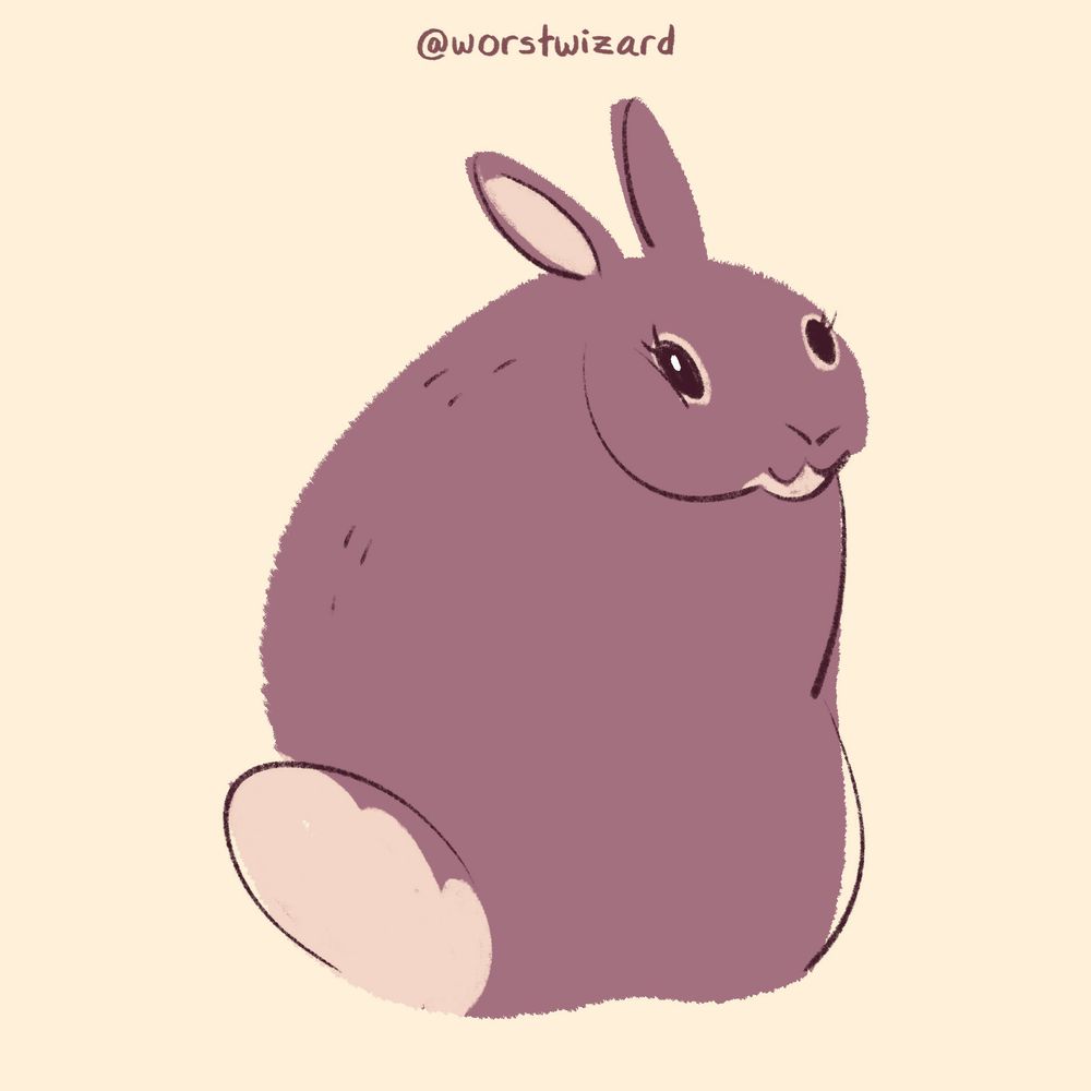 a very robust brown rabbit with a fluffy tail smiling