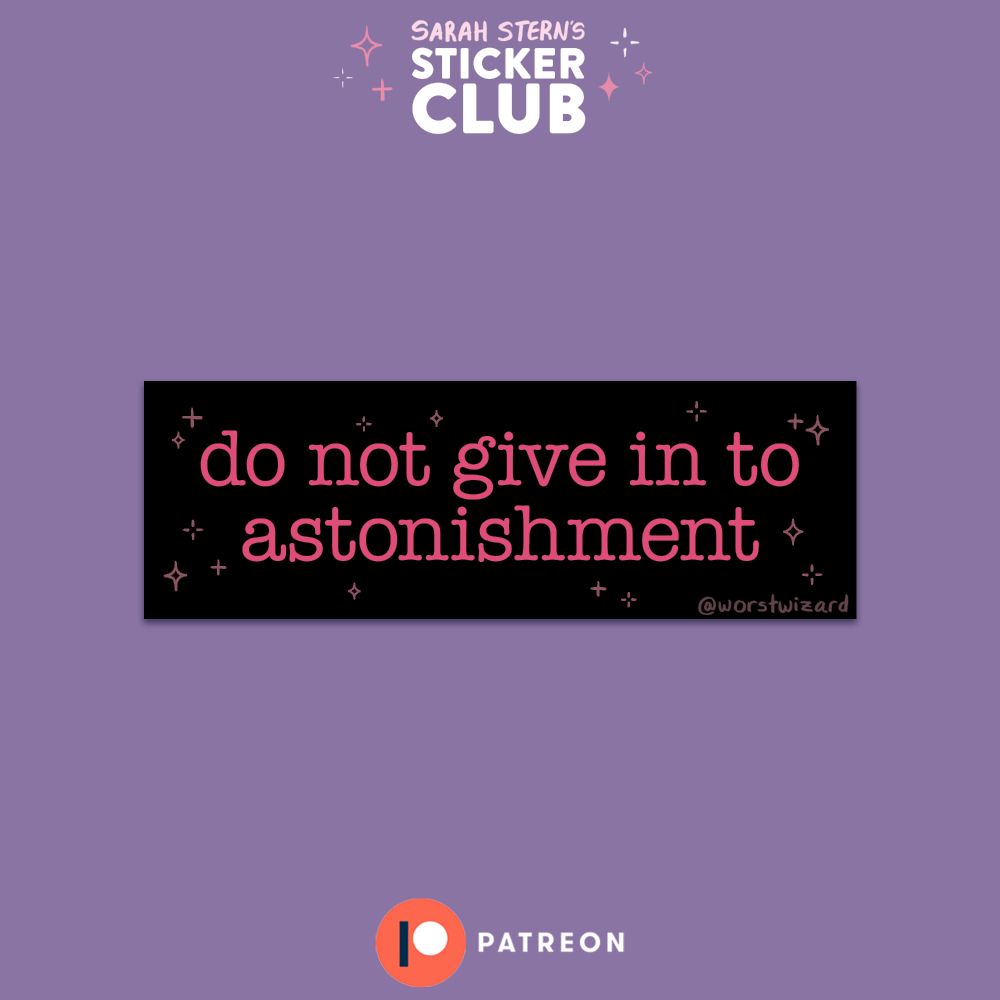 an image of a small black sticker featuring pink sparkles and the words "do not give in to astonishment" in a typewriter-like font