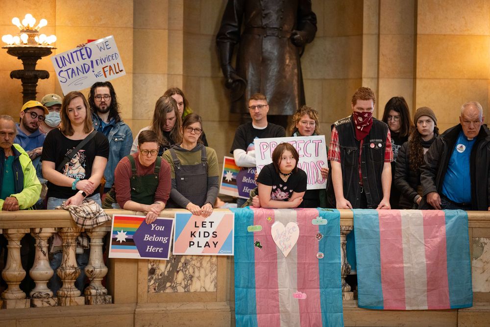 People listen to speakers during Transgender Day of Visibility at the Minnesota Capitol in Saint Paul, Minn. on Monday, March 31, 2025.