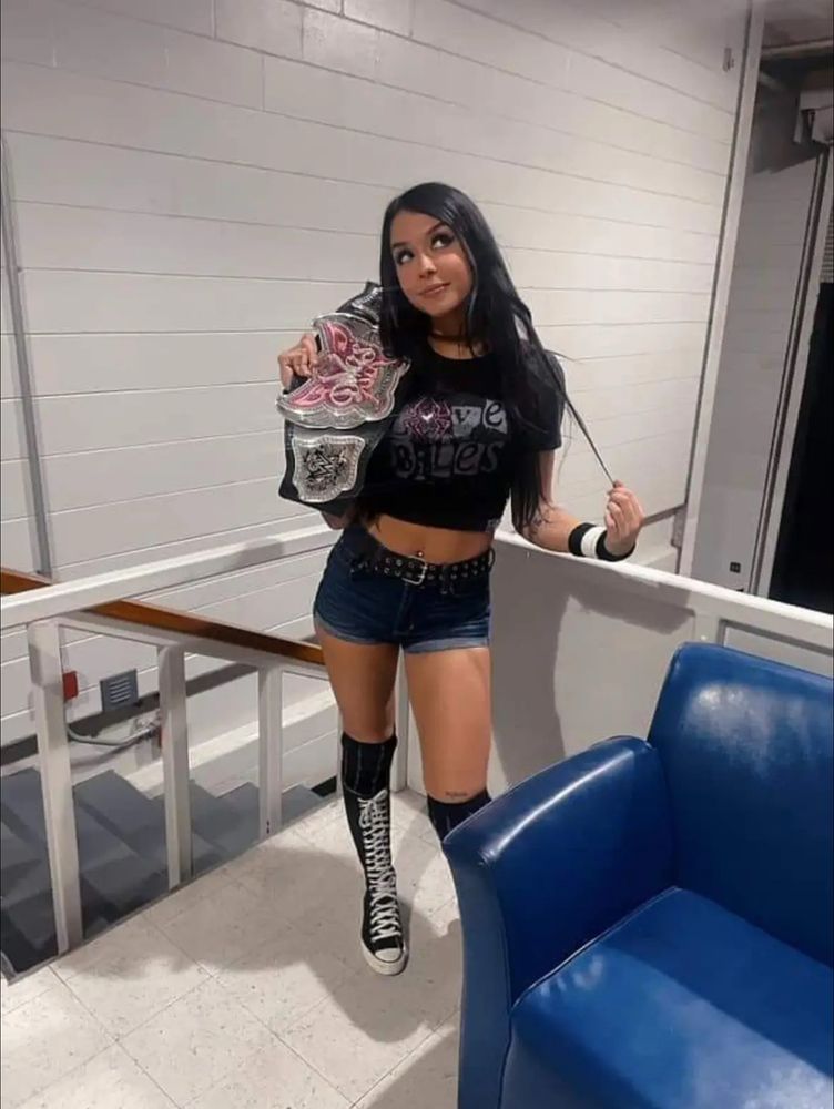 Cora Jade dressed up as AJ Lee