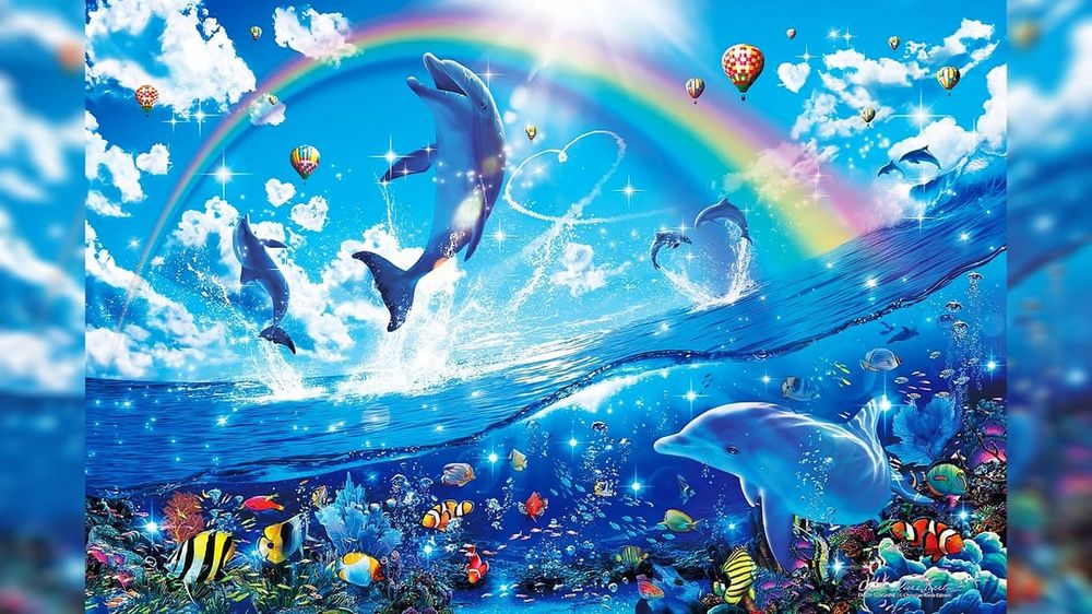 a picture of a clear, blue ocean with dolphins and other colorful marine life beneath its surface. There are also dolphins leaping from the water as a focal point. There is also a rainbow and several hotair balloons in the sky, giving the image a euphoric mood.