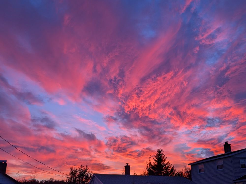 Party cloudy dusk with vibrant pinks and purples
