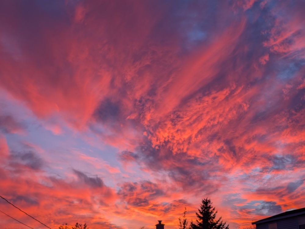 Party cloudy dusk with vibrant pinks and purples