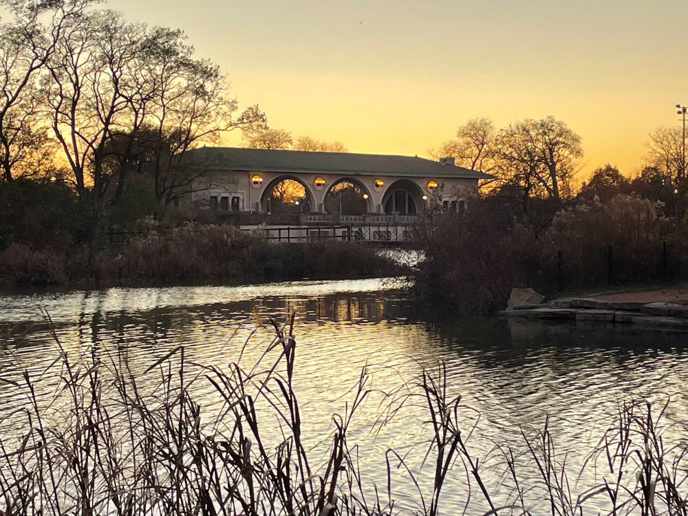 Sunset over the Humboldt Park lagoon and boathouse 