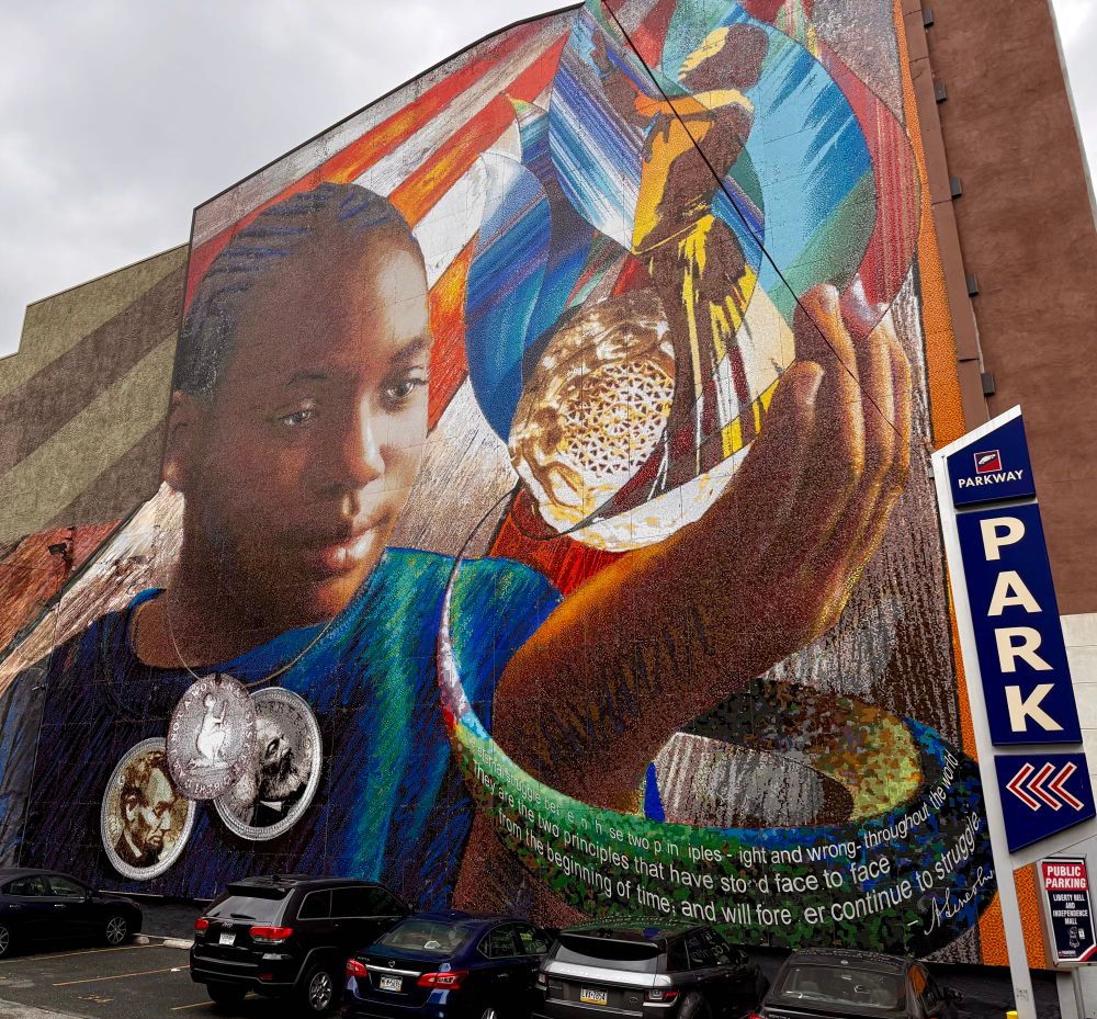 Mural in downtown Philadelphia showing a young boy holding a metal with a necklace that has three coins attached one is a bust of Abraham Lincoln, one is of Frederick Douglas and another one is a kneeling figure that says am I not a woman sister and the date 1839. 

The quote on the mural is from Abraham Lincoln that says “it is the eternal struggle between these two principles, right and wrong, throughout the world. They are the two principles that have stood face-to-face from the beginning of time and will forever continue to struggle. “

Although not on the mural, an important quote from that debate continues 	“The one is the common right of humanity, and the other the divine right of kings. It is the same principle in whatever shape it develops itself. It is the same spirit that says, ‘You work and toil and earn bread, and I’ll eat it.’ No matter in what shape it comes, whether from the mouth of a king who seeks to bestride the people of his own nation and live by the fruit of their labor, or from one race of men as an apology for enslaving another race, it is the same tyrannical principle.”
