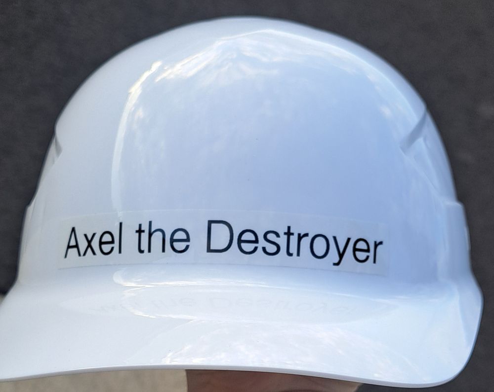 A white bumpcap with a label on it that reads 'Axel the Destroyer'. My boss thinks he's funny.