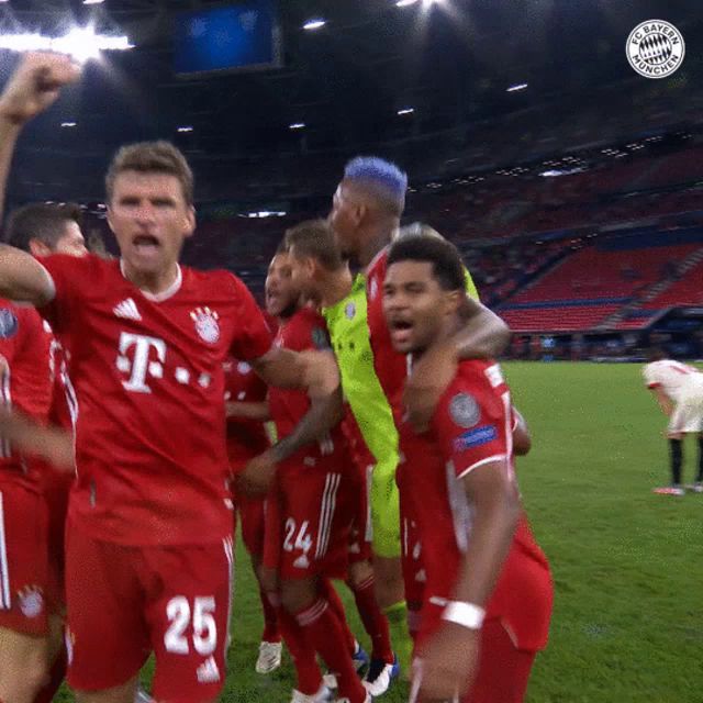 a group of soccer players wearing red jerseys with t-mobile on the front