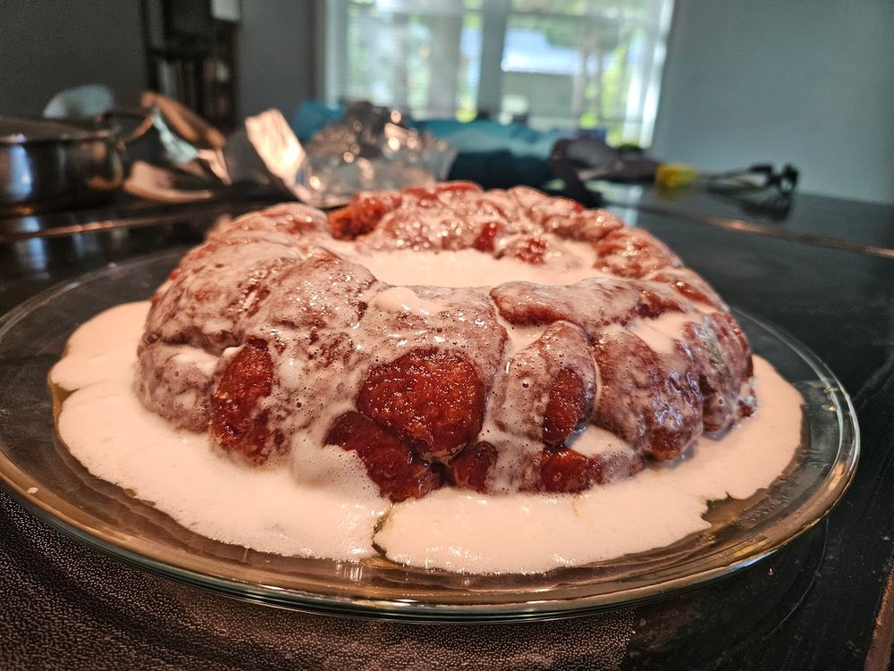 a monkey bread (bunch of lumps of dough baked together in a bundt pan, so they're roughly a giant donut shape and can be torn back apart to eat), doused in a white 'sauce' made of marshmallows melted into a bit of milk. messy sugary deliciousness.