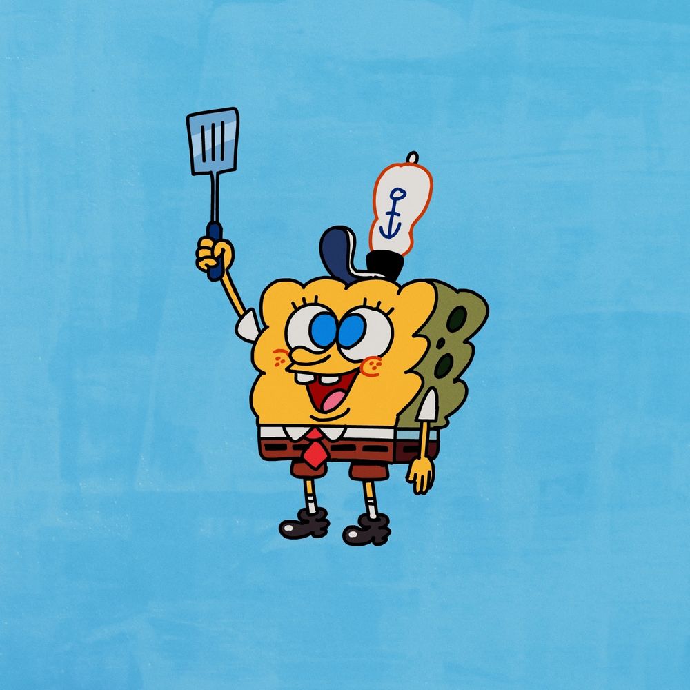 Optimistic yellow sponge holding spatula.