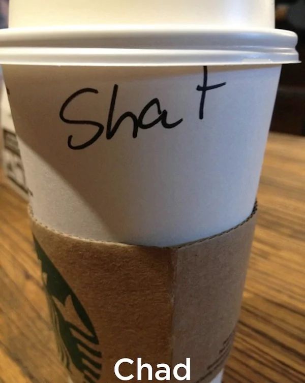A Starbucks cup that appears to have the name "Shat" on it. The subtitled text says "Chad".