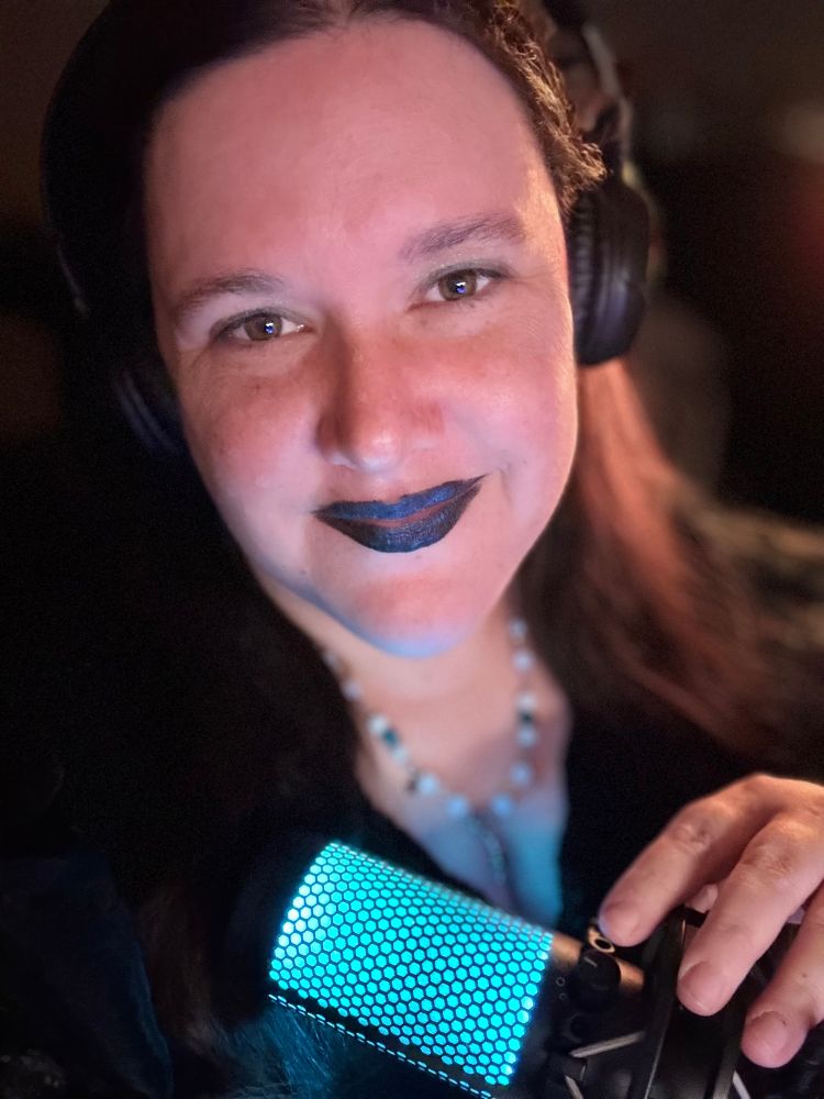 A selfie of Jocelyn with their HyperX mic wearing Phailyn inspired make-up.