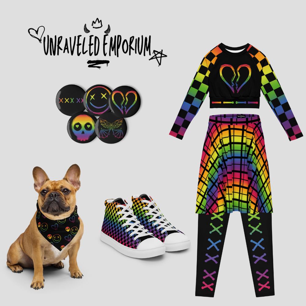 Text reads "Unraveled Emporium." Image features clothing items, shoes, pins, and a brown dog with a bandana on it. The items are black with rainbow designs, scribbly, checkered, or plaid. 