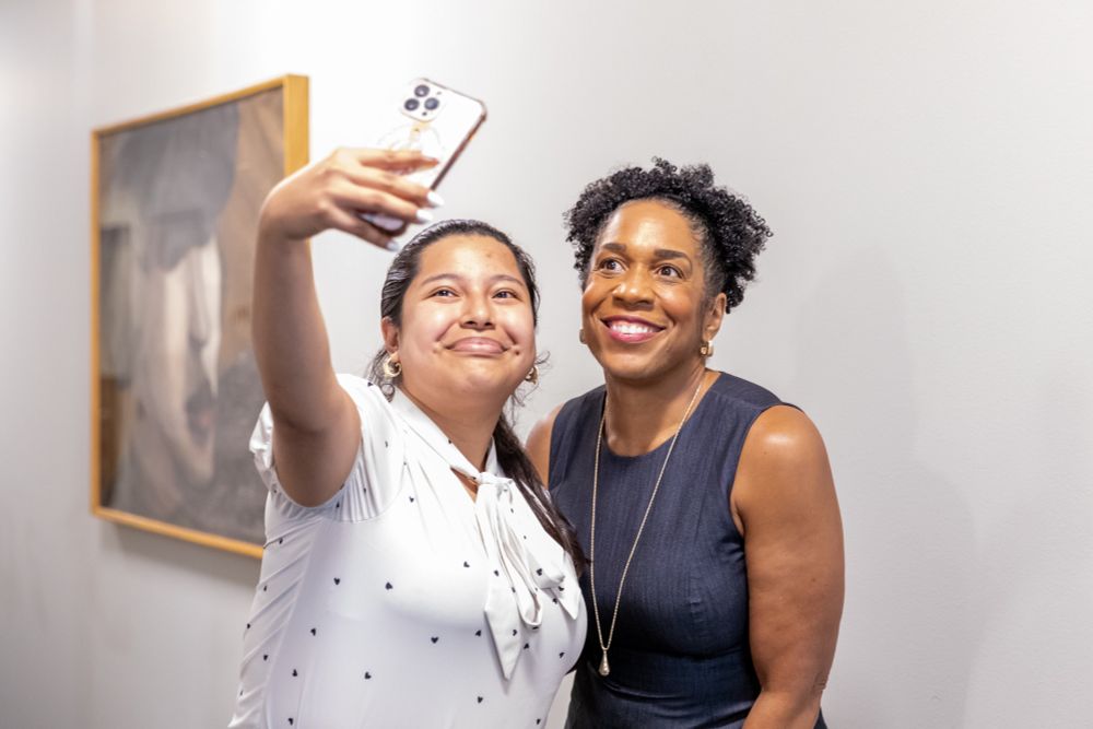 Lt. Gov Stratton smiles for a selfie with a guest. 