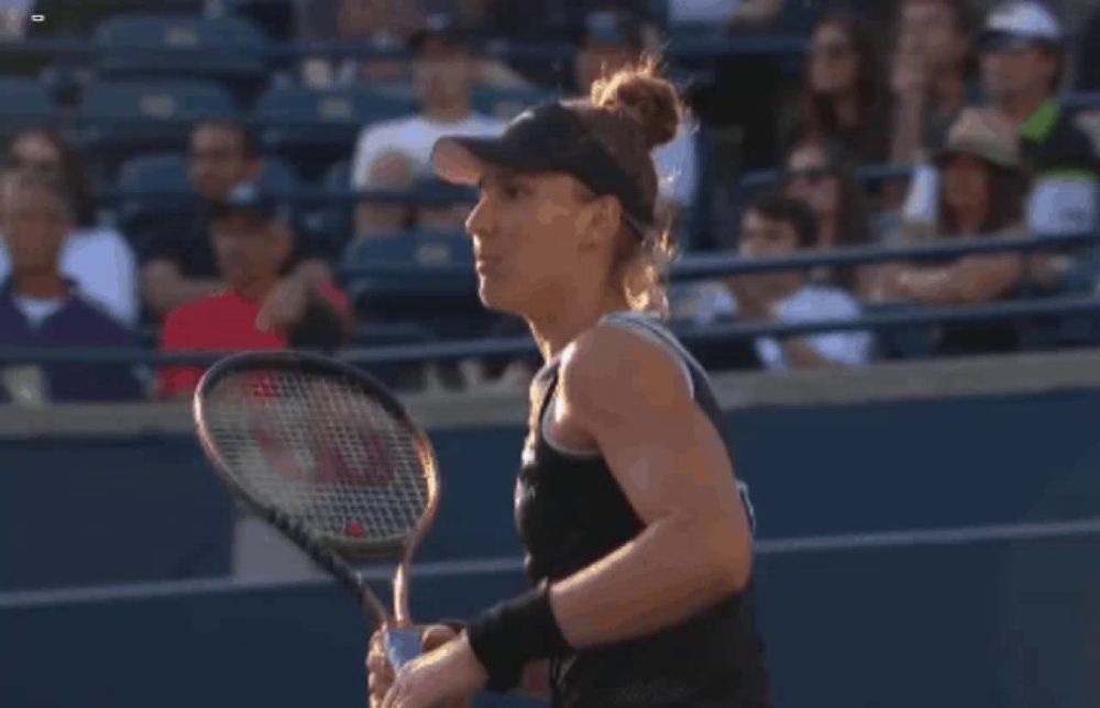 a woman wearing a visor that says sazto on it