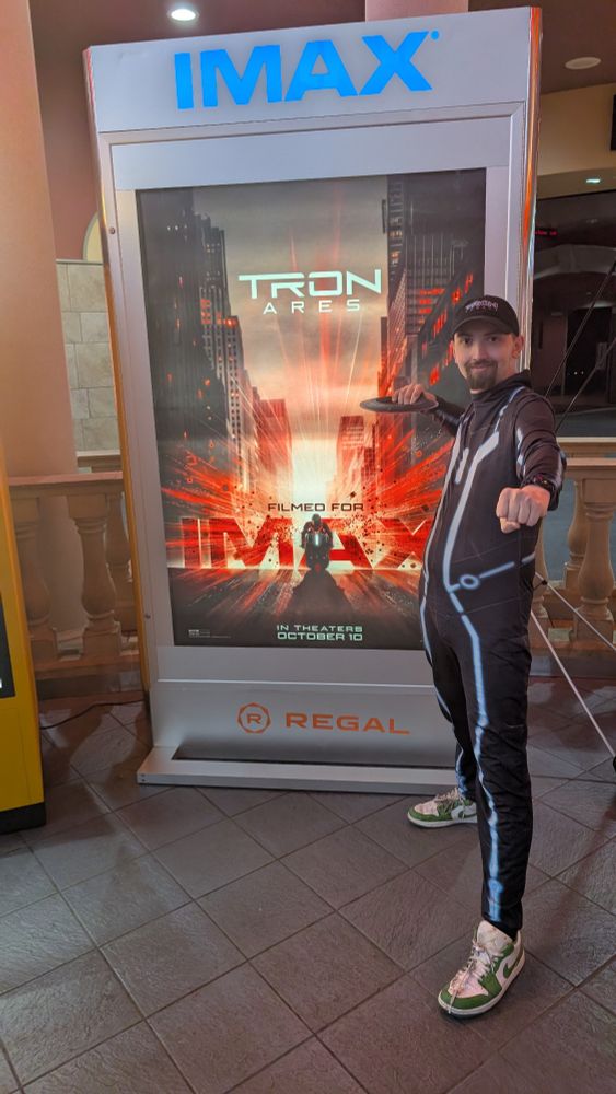A picture of OtterlyNoah attending the early access premiere of the Disney film Tron Ares. He's very excited for this since it was 15 years since Tron Legacy 