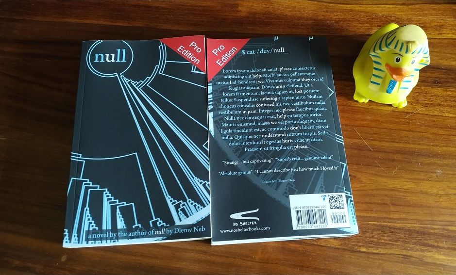 Image shows the front and rear cover of novel titled "null". In the corner of the cover is a red tag denoting that this is the "Pro Edition". There is also a yellow rubber duck with an Ancient Egyptian Monarch's head dress in the photo.