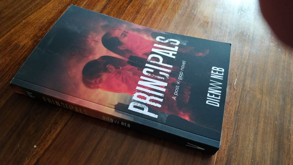 Photograph of the front cover and spine of Principals 2nd Edition at a slant angle.