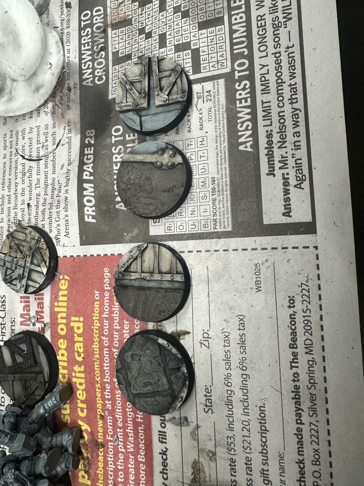 4 32mm bases painted in brown (soil), grey (rockcrete), and bone (reinforced panels), washed with oil