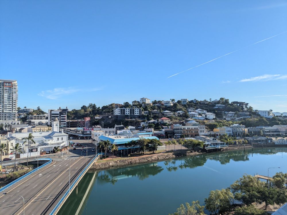 A photograph of downtown Townsville, Queensland, featuring Ross Creek and views of Flinders Street on Wulgurukaba country.