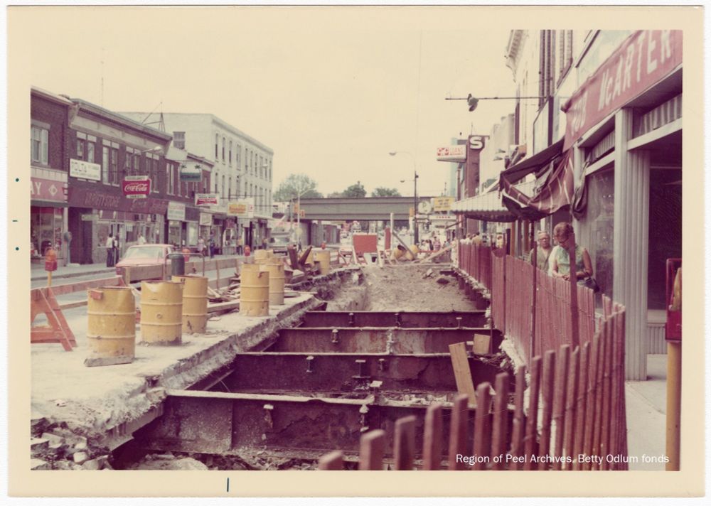 Main St in downtown Brampton looking north. Beams exposed during construction explain the 1970s. Beams apparently due to building over fmr creek. 