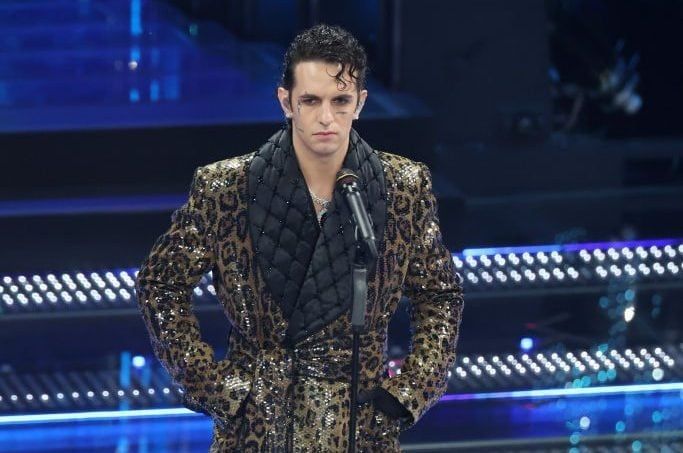 Achille Lauro wearing a sequined leopard print coat with an enormous quilted black collar
