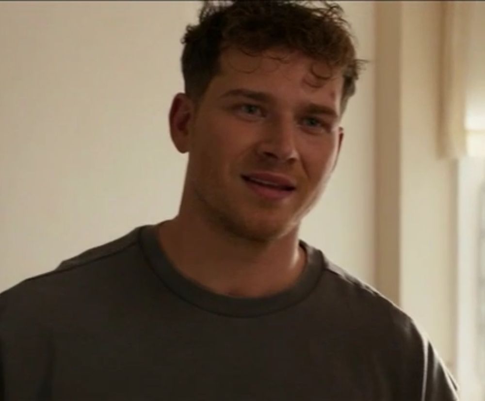Buck (Oliver Stark) in a screengrab from 8x11 of 9-1-1 (ABC). His hair is a mess.