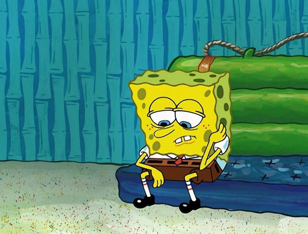 Spongebob sitting, a morose expression on his face.