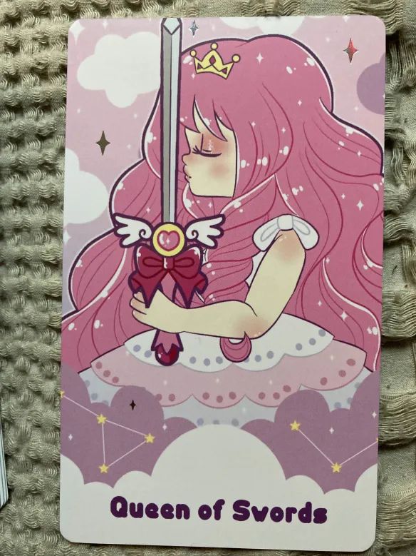 The Queen of Swords card from the Pastel Journey deck - the card is drawn upright.