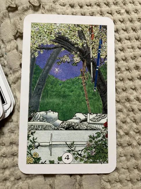 The four of swords from the Robin Wood Tarot deck.