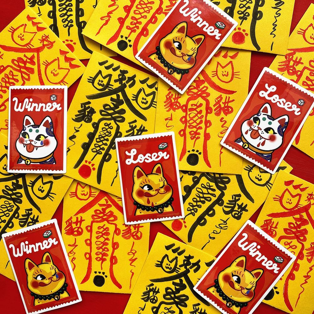 Photo of my candy Gachapon stickers with their new packaging that looks like a Chinese talisman 