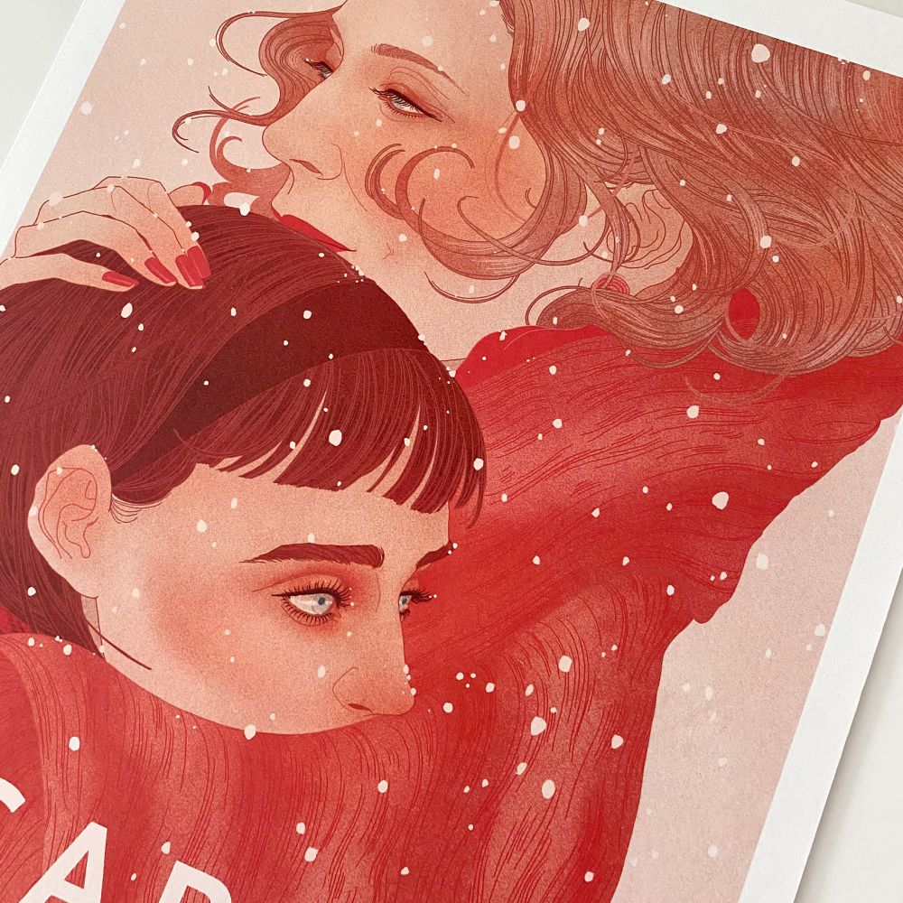Photo of my giclee print of the film Carol. The characters Carol and Therese are embracing in the snow looking melancholic. 