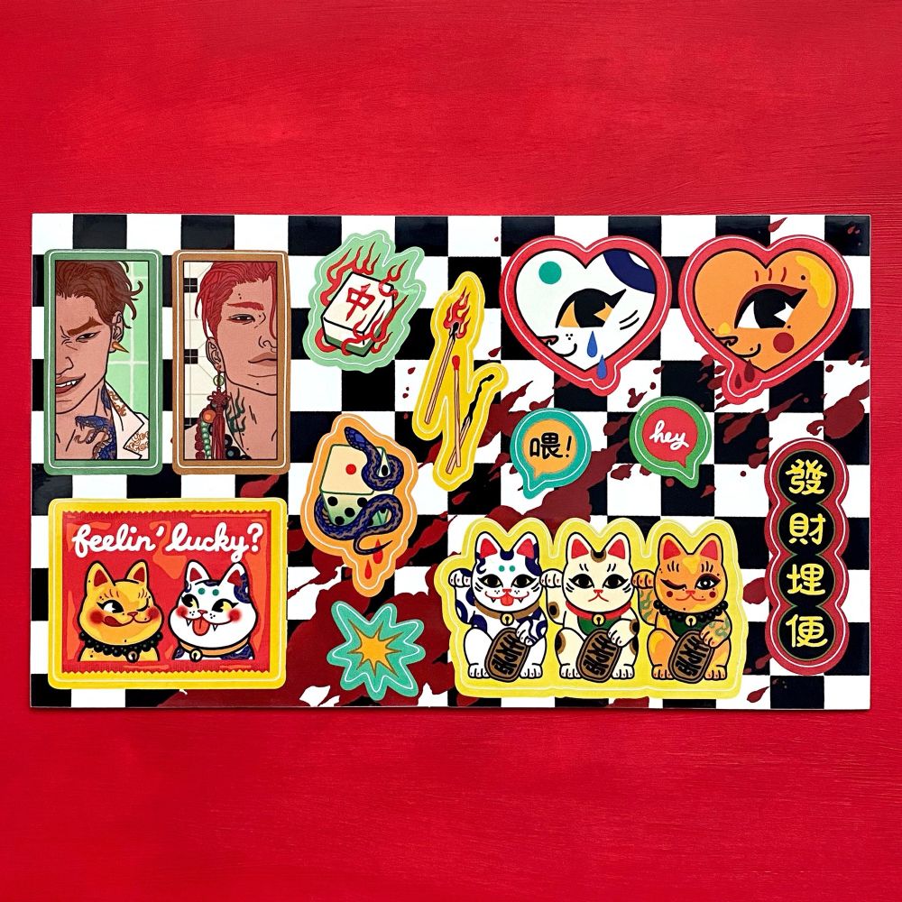 Sticker sheet of lucky cats, mahjong tiles, dice, matches, candy wrappers