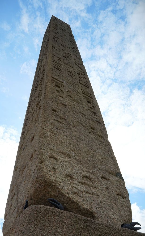 The Obelisk was created around 1425 BCE in Heliopolis, Egypt, an area north of modern-day Cairo. Central Park is the third location for this 220-ton monolith, a single piece of stone carved out of granite at the quarries of Aswan, a major source of stone for Egyptian antiquities. It was one of two obelisks commissioned by Pharaoh Thutmose III for the Temple of the Sun in Heliopolis, near modern-day Cairo. Scholars believe that obelisks represented eternity and immortality, and their long, tapering form functioned to connect the heavens and the earth. Their pinnacles were typically covered in gold to reflect the sunlight. When the Romans discovered the two obelisks in 12 BCE, both had toppled and were lying partially buried in the sand. The Romans transported the obelisks to Alexandria and installed them at an entrance to a temple dedicated to Julius Caesar. The temple had been built by Cleopatra, which is one theory of how they came to be called “Cleopatra’s Needles,” a name that still endures. The Romans created the bronze crabs as supports for the damaged obelisks. In Roman mythology, crabs are associated with Apollo, the sun god, thus continuing the solar connection. In the 1870s, the Egyptian government gave one obelisk to England, and the second obelisk was gifted to the United States by the Khedive Ismail Pasha in commemoration of the opening of the Suez Canal. The removal of the Obelisk and its transportation to New York took over a year, and was a significant feat of logistics, diplomacy, and engineering. It was installed in Central Park in January 1881. https://www.centralparknyc.org/locations/obelisk#:~:text=Standing%20between%20the%20Great%20Lawn,oldest%20outdoor%20monument%20in%20NYC.&text=In%20the%201870s%2C%20the%20Egyptian,opening%20of%20the%20Suez%20Canal. 