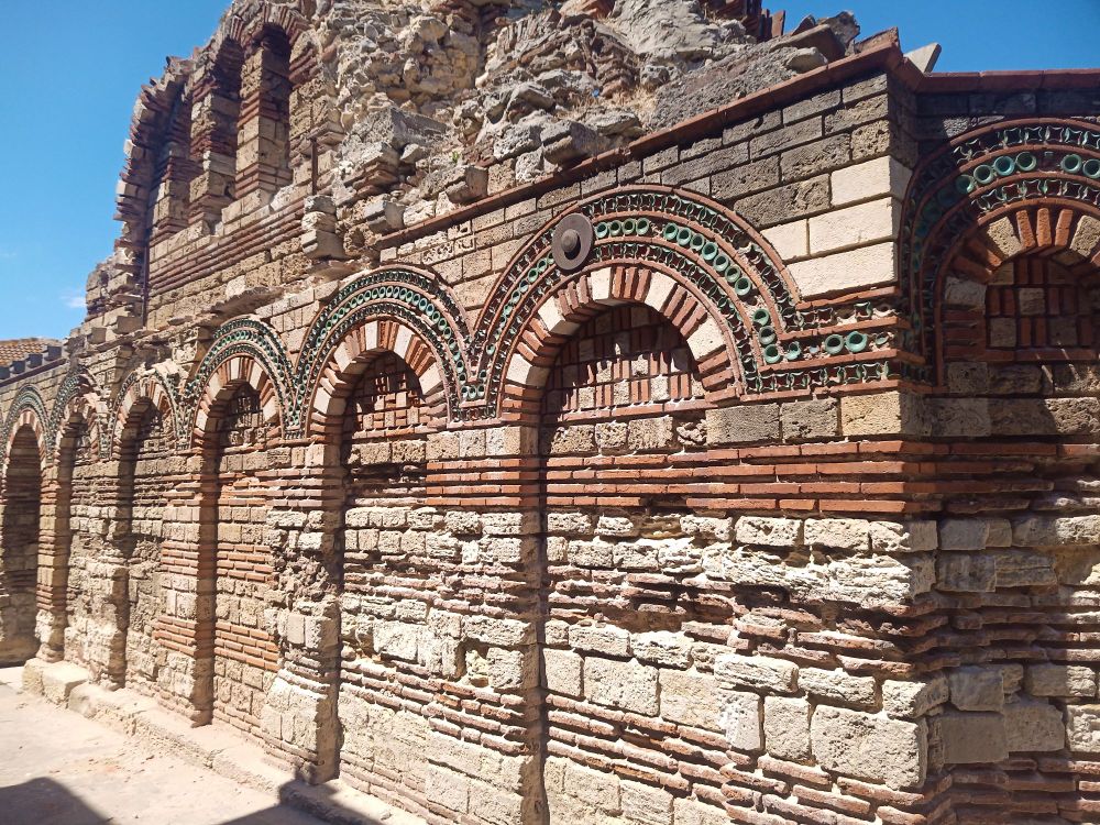 Ruins of the Archangels Michael and Gabriel church, photo, wall pavement close-up.