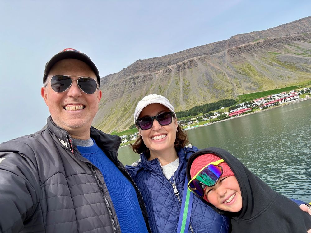 Me, my wife, and our son posing in front of the volcanic rock in ‎⁨Ísafjörður⁩.