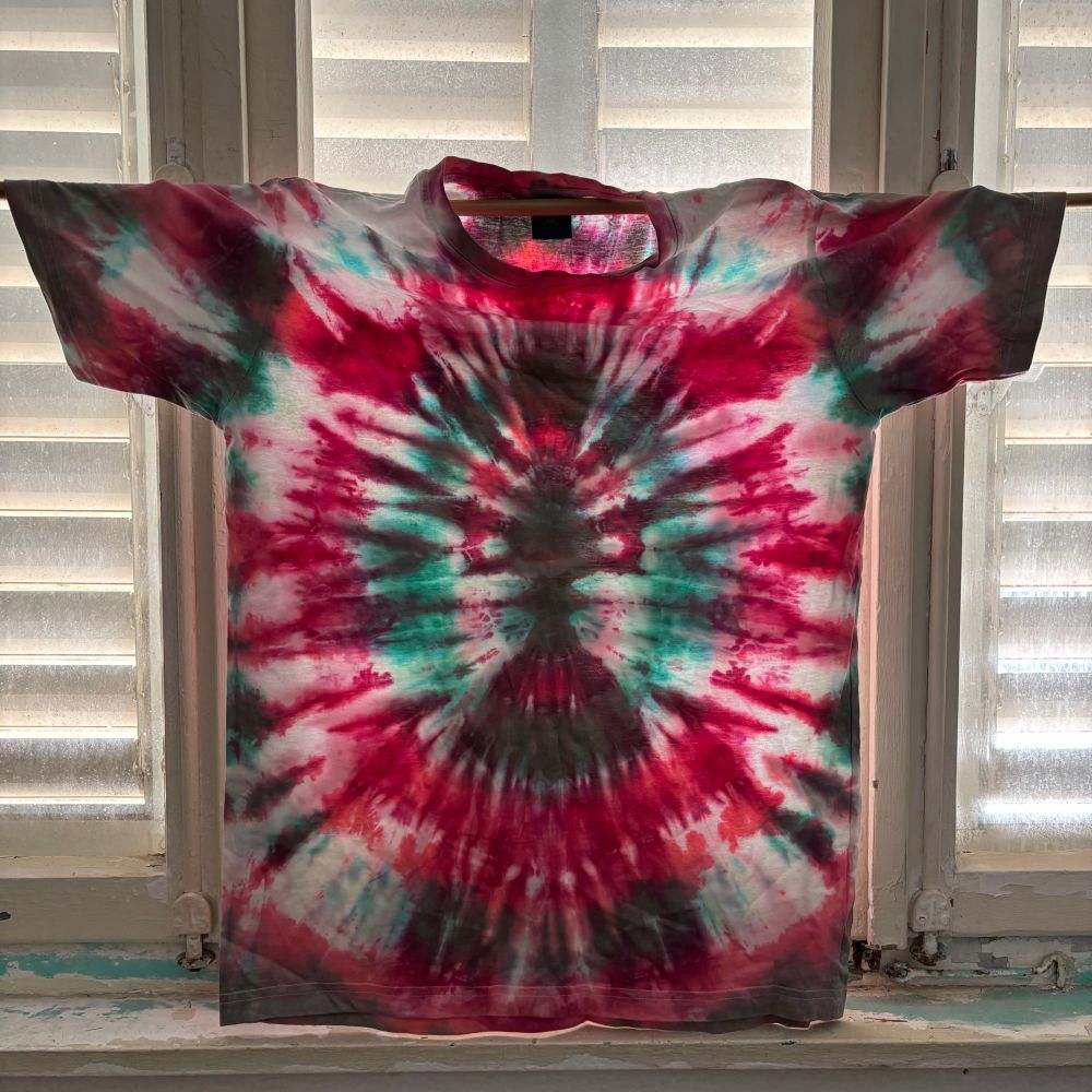 T-shirt hanging colorful with green and red  puddle pattern 