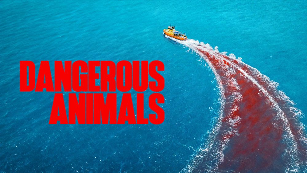 A yellow boat cutting through the blue ocean water leaving a trail of blood. The title “Dangerous Animals” is in red text on the left side of the image