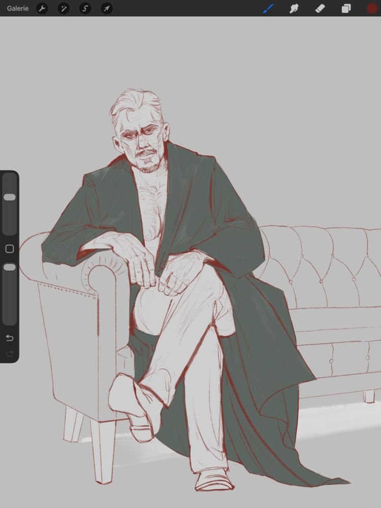 An older man sits on a 1930s style leather couch. He‘s wearing a robe, pants and shoes. His chest is bare, his facial expression serious, almost grim.