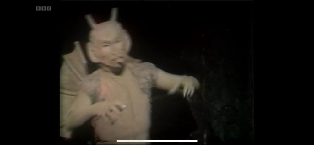 Still: a kinda friendly looking guy, tongue out