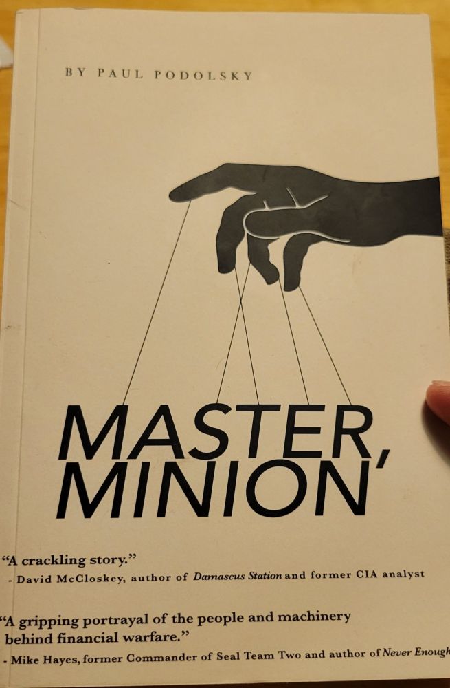 Hand pulling strings book cover of Master, Minion by Paul Podolsky.