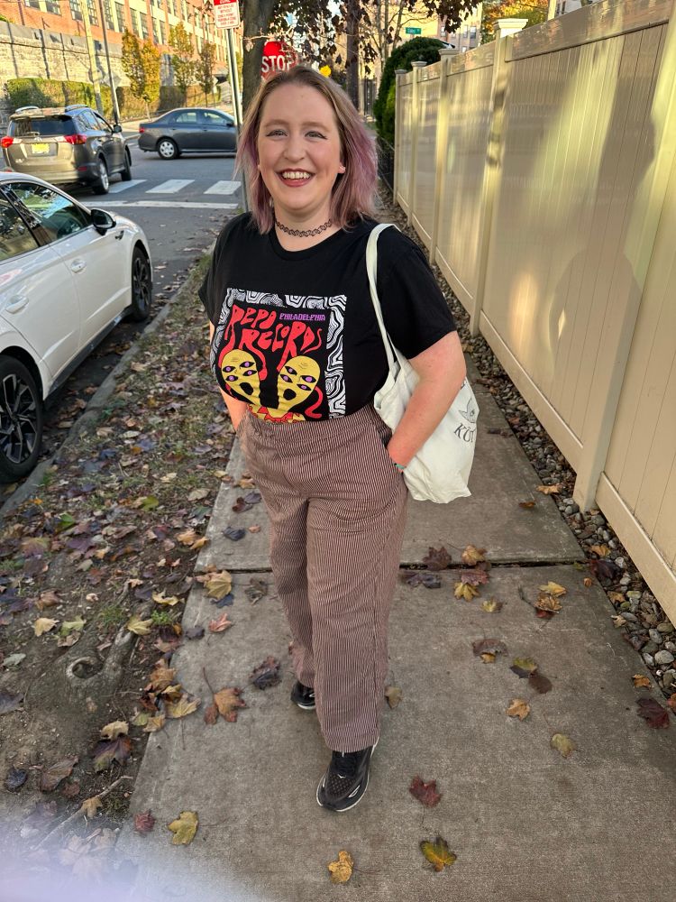 Claire standing on the sidewalk 