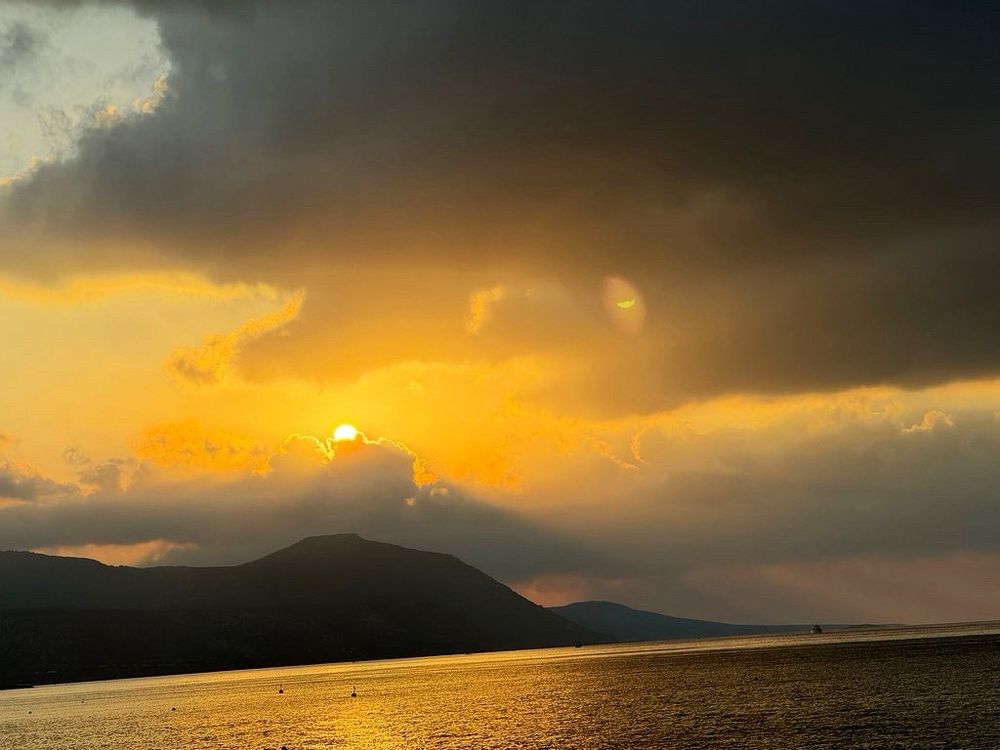 Sunset over sea and mountains in Latchi, Cyprus.