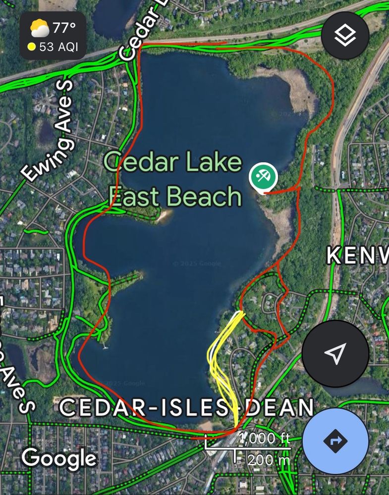 A map of cedar lake with a red line showing paved/dirt trails that circle the loop a d a yellow line showing a missing section from the south beach to the canal